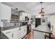 Well-lit kitchen features modern appliances, a spacious countertop, and eye-catching decorative black and white patterned backsplash at 2700 E Allred Ave # A3, Mesa, AZ 85204