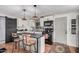 Modern kitchen featuring updated appliances, an island with seating, and stylish decor that complements the overall space at 2700 E Allred Ave # A3, Mesa, AZ 85204