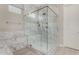 Elegant glass shower in luxurious bathroom with upscale tile design at 29606 N Tarragona Dr, Peoria, AZ 85383