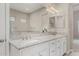 Luxury bathroom with dual vanity, granite countertops, and modern lighting at 29606 N Tarragona Dr, Peoria, AZ 85383