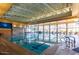 Indoor pool with marked lanes, high ceilings, and ample sunlight at 29606 N Tarragona Dr, Peoria, AZ 85383