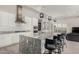 Modern kitchen featuring a large island with pendant lighting, stainless steel appliances, and white cabinets at 29606 N Tarragona Dr, Peoria, AZ 85383