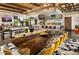 Spacious living room with a large dining table and open kitchen in background at 29606 N Tarragona Dr, Peoria, AZ 85383