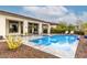 Beautiful backyard pool with a spa and a covered patio with lounge seating at 29606 N Tarragona Dr, Peoria, AZ 85383