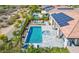 Inviting backyard oasis with a sparkling pool, spa, lounge area, and solar panels at 29606 N Tarragona Dr, Peoria, AZ 85383