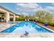 Relaxing pool and spa with stone coping, with a well-manicured yard and greenery creating a private retreat at 29606 N Tarragona Dr, Peoria, AZ 85383