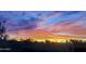 Vibrant sunset view with colorful pink, purple, blue, and orange hues at 29606 N Tarragona Dr, Peoria, AZ 85383