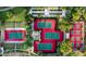 Aerial view of multi-colored tennis courts with manicured landscaping at 29606 N Tarragona Dr, Peoria, AZ 85383