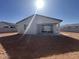An expansive backyard featuring a covered patio area and block fencing, ideal for outdoor living at 32723 N Newby Dr, San Tan Valley, AZ 85140