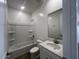 Bright bathroom with tub and shower combination and a vanity with modern fixtures at 32723 N Newby Dr, San Tan Valley, AZ 85140