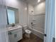 A clean bathroom with a vanity, toilet, and shower-tub combination at 32723 N Newby Dr, San Tan Valley, AZ 85140