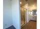 Modern bathroom with a glass-enclosed shower, white vanity, and tile floors at 32723 N Newby Dr, San Tan Valley, AZ 85140