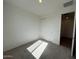 A cozy bedroom with carpet, closet, and neutral walls at 32723 N Newby Dr, San Tan Valley, AZ 85140