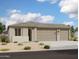Charming single-story home featuring a three-car garage and low maintenance desert landscaping at 32723 N Newby Dr, San Tan Valley, AZ 85140
