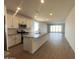Spacious kitchen with a large island, stainless steel appliances, and tile flooring at 32723 N Newby Dr, San Tan Valley, AZ 85140