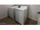 Laundry room featuring a white washer and dryer set and tile flooring at 32723 N Newby Dr, San Tan Valley, AZ 85140