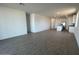 Spacious open living space with tile flooring and recessed lighting throughout at 32723 N Newby Dr, San Tan Valley, AZ 85140