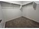 Carpeted walk-in closet with shelving for optimal storage and organization at 32723 N Newby Dr, San Tan Valley, AZ 85140