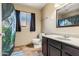 Bathroom featuring a vanity, toilet and a shower with a decorative shower curtain at 3640 W Redfield Rd, Phoenix, AZ 85053