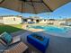 Inviting backyard with pool, spa, patio seating, and firepit, creating an outdoor oasis for relaxation at 3807 E Altadena Ave, Phoenix, AZ 85028