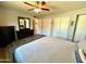 The bedroom features three closets with sliding doors, and dark wood dressers at 3807 E Altadena Ave, Phoenix, AZ 85028