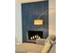 Unique fireplace with modern tile and ambient lighting at 3807 E Altadena Ave, Phoenix, AZ 85028