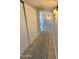 Hallway with white closets and light colored wood floors at 3807 E Altadena Ave, Phoenix, AZ 85028