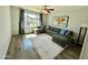 Bright living room with backyard view, a comfortable sofa and modern decor at 3807 E Altadena Ave, Phoenix, AZ 85028