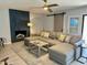 Comfortable living room with a fireplace, ceiling fan, and stylish furnishings at 3807 E Altadena Ave, Phoenix, AZ 85028
