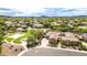 Aerial view of home in a community near green spaces, a park with baseball fields, and a pool at 40202 N Oakhurst Ct, Anthem, AZ 85086