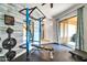 Home gym with rubber floor and weight lifting gear, offering a convenient fitness space at 40202 N Oakhurst Ct, Anthem, AZ 85086