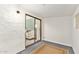 Basement featuring carpet, a window and slider leading to a living room area at 406 E Washington Ave # C, Gilbert, AZ 85234