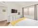 Bedroom featuring a dresser with a tv, window with curtains and carpet floors at 406 E Washington Ave # C, Gilbert, AZ 85234