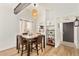 Cozy dining area with stylish furniture and a view into the kitchen at 406 E Washington Ave # C, Gilbert, AZ 85234
