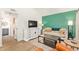 Inviting living room featuring a TV, sofa, and stylish decor at 406 E Washington Ave # C, Gilbert, AZ 85234