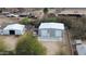 Wide aerial view of outbuildings and yard at 4311 W Siesta Way, Laveen, AZ 85339