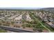 Picturesque aerial view highlighting a well-planned community with green spaces, residential housing, and accessible roadways at 4311 W Siesta Way, Laveen, AZ 85339