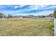 Large, well-maintained backyard with mature trees and white fencing at 4311 W Siesta Way, Laveen, AZ 85339
