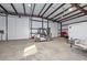 Wide barn with white walls, high ceilings, forklift, and large doors at 4311 W Siesta Way, Laveen, AZ 85339