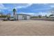 Barn exterior with multiple roll-up doors, providing ample storage and access for vehicles and equipment at 4311 W Siesta Way, Laveen, AZ 85339