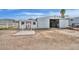 Exterior view of barn with shed and concrete pad, providing storage and workspace on a dirt lot at 4311 W Siesta Way, Laveen, AZ 85339