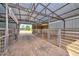 Rustic barn interior featuring metal stalls and a sturdy metal frame, offering ample space and functionality at 4311 W Siesta Way, Laveen, AZ 85339