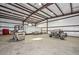 Large barn with high ceilings, interior lighting, and concrete floors at 4311 W Siesta Way, Laveen, AZ 85339
