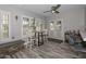 Cozy dining area with french doors, wood flooring and a modern ceiling fan at 4311 W Siesta Way, Laveen, AZ 85339