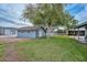 Exterior view of a charming outbuilding and beautiful green grass yard at 4311 W Siesta Way, Laveen, AZ 85339