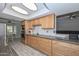 Well-lit kitchen featuring sleek countertops, stainless steel appliances and stylish cabinetry at 4311 W Siesta Way, Laveen, AZ 85339