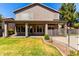 Expansive backyard features covered patio, green lawn, and mature landscaping offers relaxation and entertainment at 4531 W Flint St, Chandler, AZ 85226
