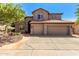 Charming two-story home features a tile roof, arched windows, and a three-car garage at 4531 W Flint St, Chandler, AZ 85226
