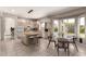 Open kitchen with island, breakfast area, and views of the backyard pool at 4531 W Flint St, Chandler, AZ 85226