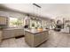 Open kitchen featuring a tile island, stainless appliances, and ample counter space; ideal for cooking and entertaining at 4531 W Flint St, Chandler, AZ 85226